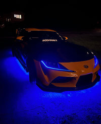 Under Glow LED Strip Kit RGB+W on an orange and black car